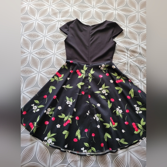 Cute party dress. Fitted top with flare skirt. Lovely floral print on the skirt. - Picture 2 of 4